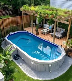 an above ground swimming pool in a backyard with deck and pergolated patio area