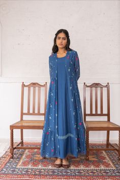 The festive sapphire jacket is layered over a matching tunic-style inner. The jacket features a tone-on-tone discharge print with contrasting applique embroidery. #Vaayu #Clothing #Applique #Embroidery #Prefestive #Jacket #Dress Blue Jacket Style, Maxi Dress Indian, Traditional Kurta, Indian Dresses For Women, A Line Kurti, Floral Chiffon Maxi Dress, Simple Gowns, Kurti Embroidery Design, Dress Idea