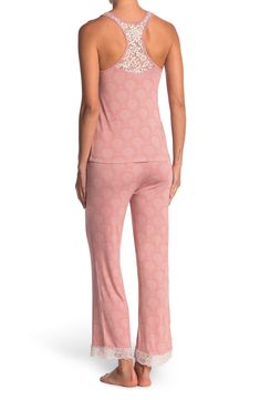 Lounge in ultimate comfort in this super soft scoop neck tank and pajama bottoms set. 2-piece set Top: 24" length; Pants: 13" rise, 29" inseam (size S) Top: scoop neck, sleeveless, racerback, knit construction, lace trim Bottoms: elasticized drawstring waist, pull-on style, knit construction, lace trim 95% rayon, 5% spandex Machine wash Imported Model’s stats for sizing: 5’11” height, 32” bust, 24” waist, 34” hips. Model is wearing size S. Comfortable Pajama Party Sets With Long Pants, Comfortable Long Pants Sets For Pajama Party, Pink Relaxation Set With Long Pants, Casual Stretch Sleepwear Matching Set, Cotton Matching Set Bottoms For Loungewear, Casual Sleeveless Loungewear Pant Set, Stretch Long Pants Sets For Sleepover, Sleepover Sets With Stretch And Long Pants, Stretch Sets With Long Pants For Sleepover