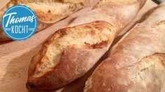 several loaves of bread sitting on top of a cutting board