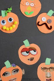 paper pumpkins with googly eyes and mustaches cut out to look like faces