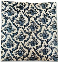 a blue and white wall hanging with an ornate design