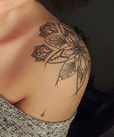 a woman with a tattoo on her shoulder