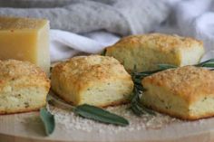 some biscuits and cheese on a wooden board