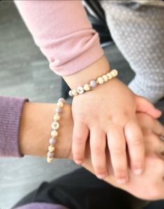 These handmade, stretchy mother-daughter bracelets are a perfect set for any mom, grandma or aunt and her special little gal. Glass and shell beads create a simple, classy look that can work for everyday wear. Select from the following colors: -Wood/neutral -Mauve Seed Bead -Butter Yellow Seed Bead -Cotton Candy Seed Bead -White Seed Bead As always, FREE SHIPPING Playful Personalized Bracelets For Mother's Day, Cute Handmade Bracelets For Mother's Day, Handmade Cute Name Bracelet For Mother's Day, Playful Personalized Everyday Stretch Bracelet, Cute Stretch Bracelet For Mother's Day And Friendship, Cute Everyday Bracelets For Mother's Day, Handmade Everyday Bracelets For Mother's Day, Everyday Stackable Stretch Bracelet For Mother's Day, Cute Personalized Friendship Bracelets For Mother's Day