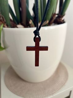 A stylish wooden cross necklace on a adjustable 2mm wax cord. Pull the tail of each knot to shorten. Each necklace is measured, cut, thread and tied personally to create this simple yet fancy little design. Handmade in Norfolk. Pendant size: 44mm up / 29mm across.  Please message me if you have any special requirements regarding length or size of chord. Adjustable Brown Cross Necklace, Wooden Cross Necklace, Necklace For Him, Knot Tie, Wooden Cross, Little Designs, Everyday Necklace, Tie Knots, Norfolk