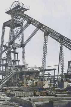 an old black and white photo of a large crane in the middle of construction work