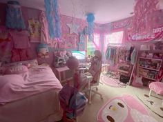 a bedroom with pink and blue decorations on the walls