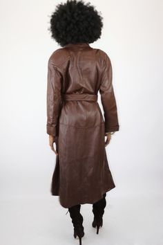 Come on with the foxy brown! If you are tired of the standard black leather coat, this brown delight does not disappoint! This trench coat is simply breathtaking in person. It’s a gorgeous, soft brown leather that is nearly perfect. It has its original belt which is also flawless and shows no real signs of wear. You will LOVE this coat! Made in Korea Size Large Measurements in Inches: Shoulders: 22 Bust: 44 Waist: 44 Sleeve: 22.5 Hips: 50 Fitted Brown Belted Outerwear, Brown Leather Long Coat Jacket, Brown Belted Fitted Leather Jacket, Elegant Long Brown Leather Jacket, Elegant Brown Leather Long Coat, Elegant Brown Leather Jacket For Fall, Brown Belted Leather Jacket With Long Sleeves, Spring Brown Belted Leather Jacket, Spring Brown Leather Jacket