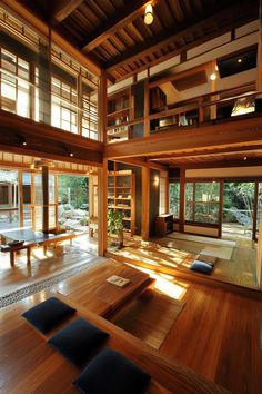 a large room with wooden floors and lots of windows