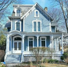 a blue house with white trim and windows