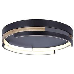 a black and gold circular light fixture with dimmers on the bottom half of it