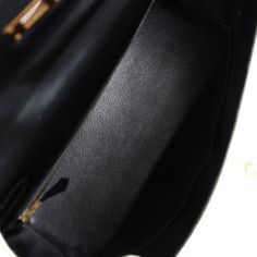 This vintage Kelly, in the Retourne style, is in Black box calfskin leather with gold hardware and has tonal stitching, two front straps with front toggle closure, single rolled handle and removable shoulder strap.The interior is lined with Black chevre leather and has one zip pocket with an Hermes engraved pull and two open pockets on the opposite side.Collection: U CircleOrigin: FranceCondition: Vintage; Excellent - This bag retains its shape. There's no plastic on the hardware. There's visible scratching to the hardware and more moderate scratching to the hardware feet. The exterior leather has wear mainly around bottom corners and top handle has minor wear to edge paint. There's light creasing more to the back exterior leather. The interior leather has a few small press markings and so Formal Leather Bag With Gold Clasp, Hermes Kelly Retourne, Vintage Kelly, Hermes Birkin 25, Hermes Constance, Vintage Hermes, Birkin 25, Sneaker Jewelry, Bottega Veneta Shoulder Bag