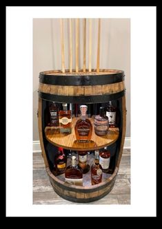 a wooden barrel filled with lots of bottles