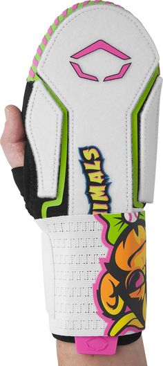 a person holding up a white glove with pink, yellow and green designs on it