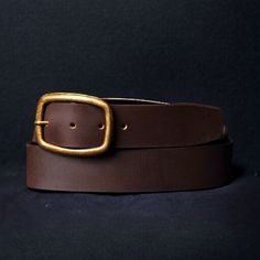 Handmade in our Toronto studio, Amara is a full grain leather belt that features a gold, rounded buckle. It can be worn as a waist belt around a dress or a regular belt around some high rise jeans. The meaning behind Amara, "Eternal," perfectly captures the essence of this versatile belt that you'll adore and cherish for a lifetime. One solid piece of full grain leather. No bonded belts, period. This results in a belt that minimizes stretch and will never break or crack at the holes. Crafted to Brown Belt With Brass Buckle For Work, Brown Workwear Belt With Brass Buckle, Vintage Leather Belt With Gold Buckle, Classic Adjustable Belt With Brass Buckle, Gold Belt Buckles For Work, Classic Belt With Gold Buckle And Adjustable Fit, Gold Leather Belts And Suspenders With Removable Belt, Gold Belt With Brass Buckle For Work, Belt With Gold Buckle