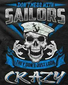 a black shirt with a skull wearing a sailor's hat and anchor on it