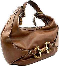 Classic Brown Shoulder Bag With Horsebit Detail, Designer Brown Shoulder Bag With Horsebit Detail, Brown Rectangular Shoulder Bag With Horsebit Detail, Rectangular Brown Shoulder Bag With Horsebit Detail, Brown Travel Bags With Horsebit Detail, Leather Business Bags With Horsebit Detail, Brown Horsebit Satchel Shoulder Bag, Brown Shoulder Bag With Horsebit Detail For Everyday Use, Brown Satchel Shoulder Bag With Horsebit Detail