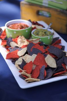 a white plate topped with chips and salsa