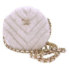 Store item: 67850 ITEM is a cute and whimsical addition with crossbody use. Zip top and compartment will carry coins and cards, no phone. In white ivory shearling and gold hardware. For 20 years, Boutique Patina has specialized in sourcing and curating the most pristine vintage and collectible accessories by searching closets around the world. Produced in 2019, almost 5 years old and in stunning condition. A popular collectible. This item is in excellent condition with very few signs of normal u Vintage View, Chanel 2019, No Phone, Chanel Vintage, Judith Leiber, Vintage Chanel, Coco Chanel, Zip Top, Vintage Leather