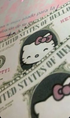 the hello kitty money is laying on top of each other