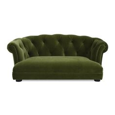 a green velvet chaise lounge chair