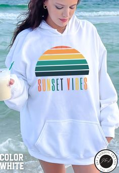 💥 Embrace the tranquil beauty of sunset with our "Sunset Hoodie." Perfectly designed for beach lovers and sunset chasers, this cozy hoodie is your ideal companion for those serene moments by the shore. Crafted with comfort in mind, our beachy sweatshirt features a relaxed fit that's perfect for layering over your favorite outfits. Whether you're soaking up the last rays of sunlight or enjoying a bonfire on the beach, our "Sunset Hoodie" is the perfect addition to your beachy wardrobe. Channel y Summer Vacation Hoodie With Crew Neck, Hoodie Sweatshirt For Summer Vacation, Casual White Hoodie For Beach Season, White Trendy Summer Hoodie, Trendy White Summer Hoodie, Summer Beach Hooded Sweatshirt, Hooded Beach Sweatshirt For Summer, White Summer Hoodie Sweatshirt, White Hoodie Sweatshirt For Summer