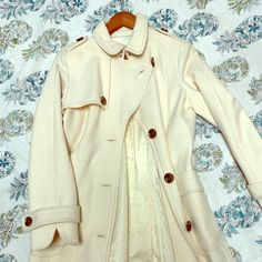 Banana Republic Mostly Wool Lined Coat, Is Cream And Beautiful. Worn Only A Few Times, Has A Belt, And Silver Metal Clasp At The Neck, Beautiful Buttons. This Coat Is Perfect For Fall And Winter And Can Be Used For Any Occasion. It’s A Size Large And Just A Little Too Big For Me So It Needs To Be Loved By Someone Else, No Stains, Rips Or Discoloring! It’s Stunning And Hopefully A New Piece To Your Wardrobe! Fitted Winter White Wool Outerwear, White Fitted Pea Coat For Fall, Fitted White Pea Coat For Fall, Elegant Fitted White Pea Coat, Fitted Beige Pea Coat With Buttons, Fitted Single Breasted Outerwear In Winter White, Fitted Single Breasted Winter White Outerwear, White Fitted Pea Coat For Work, Fitted Cream Wool Outerwear