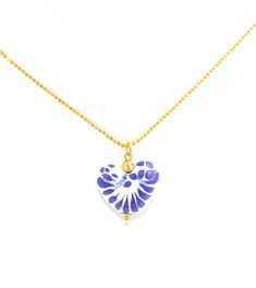 Embrace the artistry of Mexican craftsmanship with our Elegant Talavera Heart Pendant Necklace. This lovingly handcrafted piece features a stunning heart pendant, adorned with traditional cobalt blue and white Talavera designs, suspended from a delicate 19" beaded chain that gracefully complements its beauty. Each pendant is a work of art, shaped from clay and meticulously hand-painted, symbolizing the passion and dedication of the Mexican artisans who bring this jewelry to life. The 14k gold pl Blue Heart Pendant Jewelry Gift For Her, Blue Heart Charm Jewelry As Gift, Blue Heart Charm Jewelry Gift, Blue Heart Charm Jewelry For Gift, Blue Jewelry With Heart Charm For Gifting, Blue Heart Charm Jewelry As A Gift, Blue Heart Pendant Necklace As Gift For Her, Blue Heart Cut Jewelry For Gift, Personalized Blue Heart Pendant Jewelry