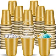 a stack of gold cups with ice cream on top and one cup in the middle