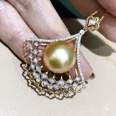 Highlight: Italian Buccellati Craft Product Information OriginSouth Sea Pearl Jewelry Processed in Japan MaterialSouth Sea Pearl, 18k Gold and Natural Diamond DimensionsPendant Approx. 3.8 x 3.2 cm Pearl Shaped: Round Size: 13-14 mm Quality: AAAA Nacre: Very Thick Color: Golden Luster: Aurora Accessories Metal: 3.2 g of 18k Gold and White Gold Other: 0.40 ct of SI Quality Natural Diamond Excluding Chain Luxury Pear Shaped Diamond Cut Jewelry, Luxury Pear-shaped Jewelry With Diamond Accents, Yellow Gold Diamond Necklace With High Luster, Luxury Pear-shaped Diamond Jewelry, High Luster Yellow Gold Diamond Necklace, Luxury Yellow Gold Akoya Pearl Jewelry, Yellow Gold Diamond Jewelry With Pear Shape, Yellow Gold Pear-shaped Diamond Jewelry, Luxury Akoya Pearl Jewelry In Yellow Gold