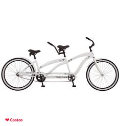 a white bicycle is shown against a white background