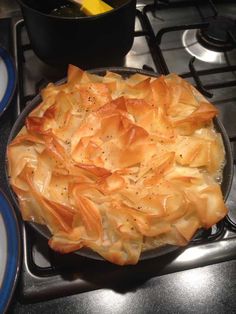 a pot pie sitting on top of a stove