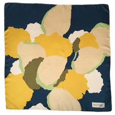 a blue, yellow and white floral print blanket