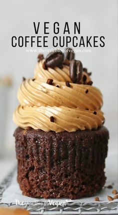 a chocolate cupcake with frosting and coffee beans on top