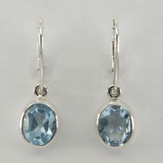 This is a pair of beautiful Blue Topaz Earrings in 925 Sterling Silver. The metal is solid silver without any nickel or other substances causing most allergies making the jewelry hypo allergenic. Size of one Earring in total 3.2 x 1.1 cm 1.21 x 0.41 inch The hooks are 1.8 cm - a bit less than 3/4 inch - in length. You will receive the item in a gift box - perfect to surprise someone or yourself. Usually we ship on the same day we receive the payment for the order. We want you to be happy with yo Blue Oval Hallmarked Earrings, Classic Blue Earrings For Everyday, Blue Topaz Earrings, Happy Customer, Handcrafted Artisan Jewelry, Topaz Earrings, Fine Jewellery Earrings, To Be Happy, 925 Sterling Silver Earrings