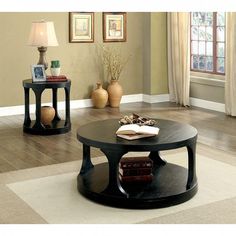 two tables with books on them in a living room