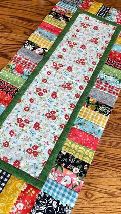 a table runner made out of patchwork fabric