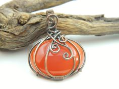 You will receive 1 pcs of Carnelian Pumpkin Pendent Copper Wire Wrapped pendant Halloween Healing Necklace Filigree Art Wire Wrap pendant Gemstone jewelry. Stone : Carnelian Pendant Size: 34 mm long include bail . Many thanks for you visit my store ♥ if you have any question please contact us. For wholesale Price Please Convo me. You can order different items as many you like . Orange Amulet Pendant Jewelry, Handmade Pendant Necklace For Halloween, Orange Round Pendant Jewelry Gift, Orange Round Pendant Jewelry As Gift, Handmade Halloween Pendant Necklace, Orange Round Pendant Jewelry For Gift, Orange Round Pendant For Jewelry Making, Orange Large Pendant Jewelry, Orange Amulet Jewelry For Gifts