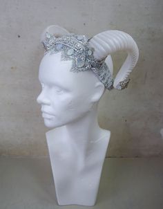 This horns on this headdress qre pearly white - on some pictures you should that the white material has this particular sheen to it. Embellishments include several kinds of lace trim, rhinestines, filigree, etc. Sequins and rhinestones are AB colour, so they shine differently in different light - you can see some of that in the pictures. This headpiece is quite shiny in direct sunlight or electrical light. The headband is flexible and light, not difficult to wear at all. It would fit a child or White Fantasy Headpiece For Party, White Headband For Costume Party, Fantasy White Wedding Headpieces, White Fantasy Wedding Headpieces, Snow Spirit, Rave Hats, Shattered Mirror, Gothic Christmas, Antler Headband