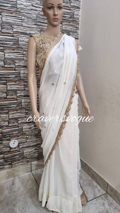 This is designer party wear saree embellished with mirror work. Blouse is made in silk fabric embellished with mirror work. Saree is made in georgette fabric embellished with mirror work all over.  Stitching  For stitched dresses you can chose from size chart or can message us for customization.our team will send you size chart for customization. Feel free to convo for any details to help you in your selection because customize dresses cannot be return or exchange.  Note: color may slightly vary Party Wear Embellished Pre-draped Saree For Festivals, Party Wear Pre-draped Saree With Mirror Work For Navratri, Party Pre-draped Saree With Mirror Work In Art Silk, Party Pre-draped Chinon Saree With Mirror Work, Elegant Pre-draped Saree With Kundan For Party, Party Wear Pre-draped Saree With Gota Work For Reception, Elegant Kundan Pre-draped Saree For Party, Party Wear Chanderi Lehenga With Mirror Work, Chanderi Lehenga With Mirror Work For Party