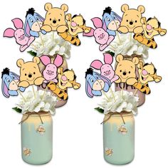 winnie the pooh centerpieces in a mason jar filled with flowers and stuffed animals