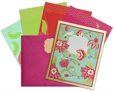 four different colored cards with flowers and chevrons on the front one has a blank space in the middle