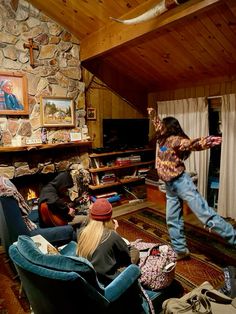 a group of people in a living room playing video games