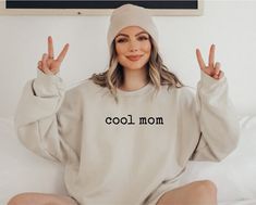 "Funny Mom Shirt | Cool Mama Sweatshirt | Funny Mother's Day Gift *JUST RELEASED* * Custom Design * Limited Edition * *This item is NOT available in stores* Show your Mom love with this custom, limited edition \"cool mom\" sweatshirt.  Ideal for any situation, a unisex heavy blend crewneck sweatshirt is pure comfort. These garments are made from polyester and cotton. This combination helps designs come out looking fresh and beautiful. The collar is ribbed knit, so it retains its shape even after washing. There are no itchy side seams on these sweaters.  .: Made with a medium-heavy fabric blend of 50% cotton and 50% polyester (8.0 oz/yd² (271.25 g/m this sweatshirt feels cozy and is the perfect choice for those colder months. .: The classic fit along with the crew neckline deliver a comfy w Xmas Gifts For Mom, New Mom Shirt, Gift For Mom Birthday, Funny Mothers Day Gifts, Funny Mom Shirt, Comfy Wear, Mom Love, Birthday Gift For Mom, Funny Mothers Day