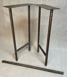 there are two metal stands on the floor