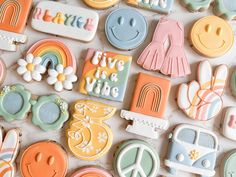 many decorated cookies are arranged on a table