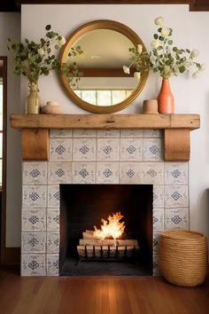 a fire place with a mirror above it