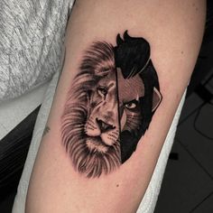 a black and white photo of a lion on the arm