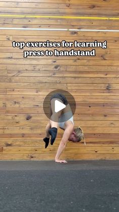 a person doing a handstand in front of a wooden wall with the words top exercises for learning press to hand stand